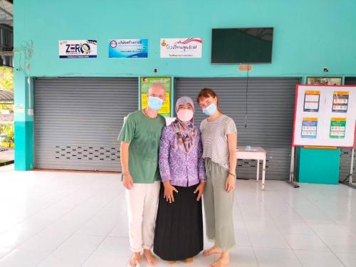 a group of people wearing face masks in a building at Connexion in Ko Yao Noi