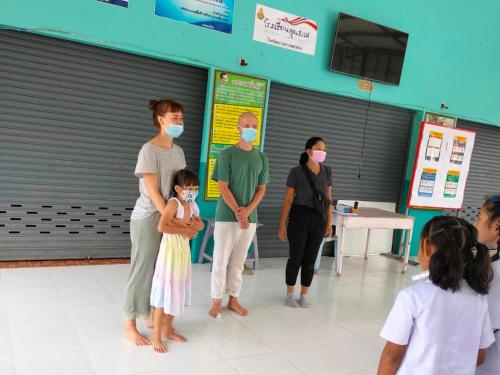 a group of people wearing masks in a room at Connexion in Ko Yao Noi