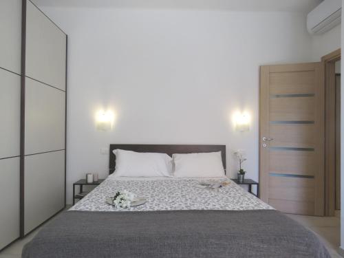 a bedroom with a large bed with flowers on it at Pasubio Apartment in Bologna