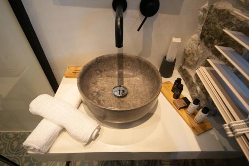 a bowl sink on a counter in a bathroom at Porto Enetiko in Nafpaktos