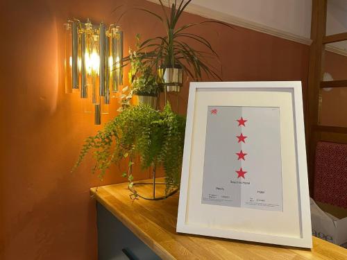 a picture frame on a table with stars on it at The Beaches Hotel and Spa in Prestatyn