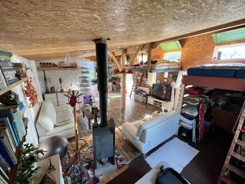an aerial view of a living room with a wood stove at DVOR POD KRíKMI in Spišský Štvrtok