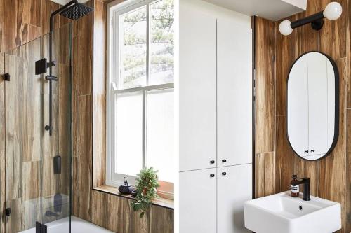 a bathroom with a sink and a mirror at The Ryokan - Zen in Sydney