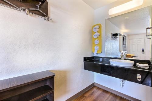 a bathroom with a sink and a mirror at Motel 6-Santa Clara, CA in Santa Clara