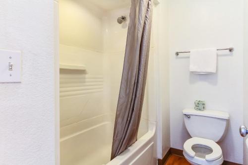 a bathroom with a toilet and a shower at Super 8 by Wyndham Santa Clara in Santa Clara