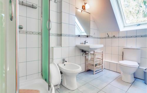 a bathroom with a toilet and a sink and a shower at Stunning Apartment In Rowy With 1 Bedrooms in Rowy