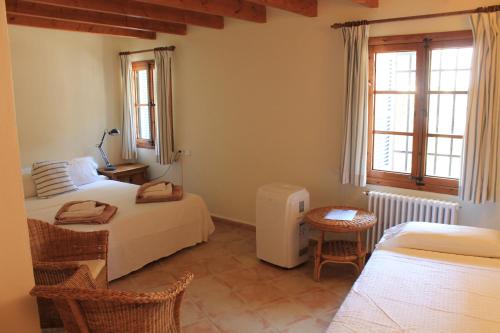Ένα ή περισσότερα κρεβάτια σε δωμάτιο στο Hotel Rural Nou Dalt Muntanya