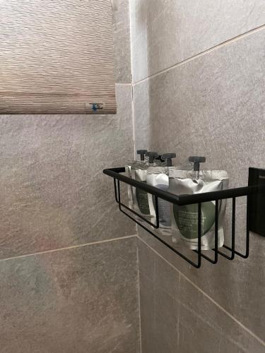 a bathroom with a sink on a wall at Hostal Casa de Luna y Sol in Úbeda