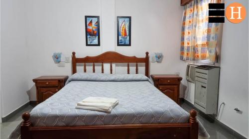 Giường trong phòng chung tại El Hotelito