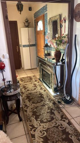 a living room with a fireplace and a mirror at Laila in Creil