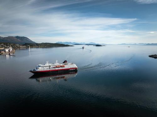 a cruise ship in a large body of water at Quality Hotel Harstad in Harstad
