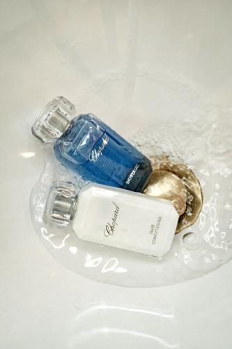 a blue and white bottle on a white plate at Grand Hotel Lviv Casino & Spa in Lviv