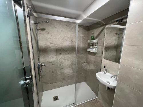a bathroom with a shower and a sink at Apartment Lucena Park in Lucena