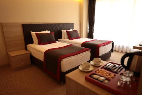 En eller flere senge i et værelse på Ramada by Wyndham Istanbul Sile