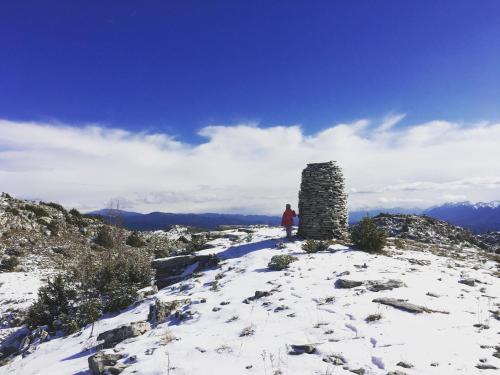 a person standing on top of a snow covered mountain at KATIKIA ZAGORI in Vitsa