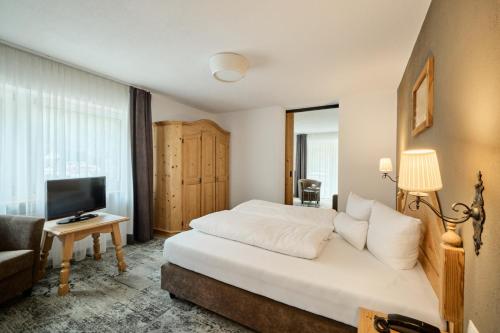 Ein Bett oder Betten in einem Zimmer der Unterkunft Natur Alpin Hotel Feichtner Hof