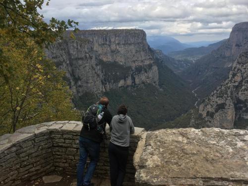 two people standing on the edge of the grand canyon at KATIKIA ZAGORI in Vitsa