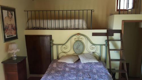 Llit o llits en una habitació de Cottage La Spagna