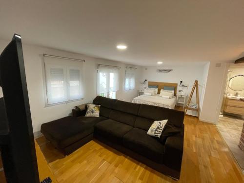 a living room with a couch and a bed at Bertoko Urdaibai II in Bermeo