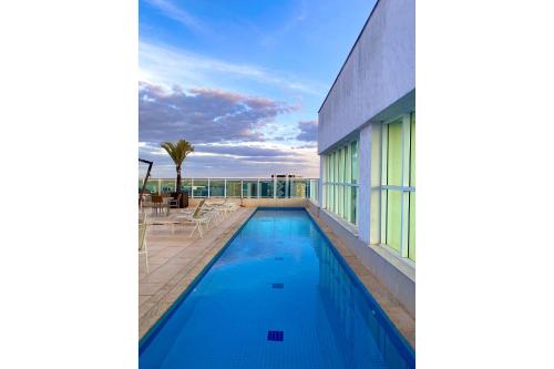a swimming pool on the balcony of a house at Saint Moritz no coração de Brasília in Brasília