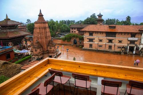a group of chairs sitting on top of a building at Hotel Traditional in Bhaktapur