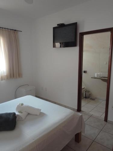 Ένα ή περισσότερα κρεβάτια σε δωμάτιο στο Hotel Guarini