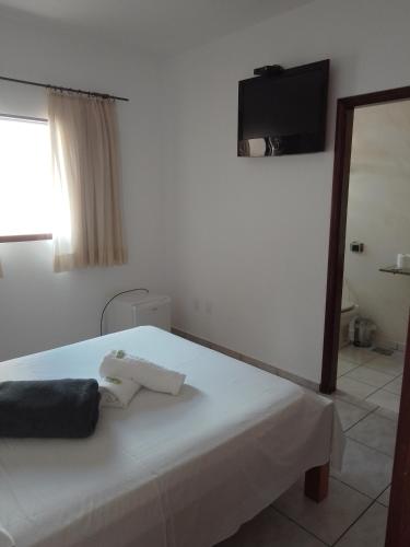 Ένα ή περισσότερα κρεβάτια σε δωμάτιο στο Hotel Guarini