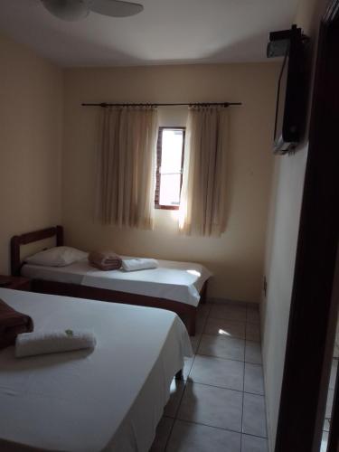 Ένα ή περισσότερα κρεβάτια σε δωμάτιο στο Hotel Guarini