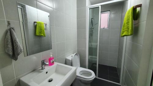 a bathroom with a sink and a toilet and a shower at New Modern Condo with Pool at Bangi in Kampong Tangkas