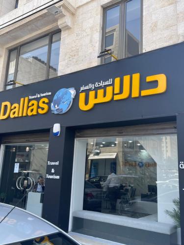 a sign for a ulsd dealership in front of a store at A Luxury 2 Bedroom With a perfect location in Sweifiyeh in Amman