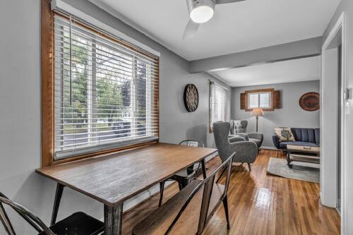 a dining room with a table and a living room at Gorgeous 2 Queen Bedroom Lower Apartment in North Buffalo with Free Driveway Parking in Buffalo