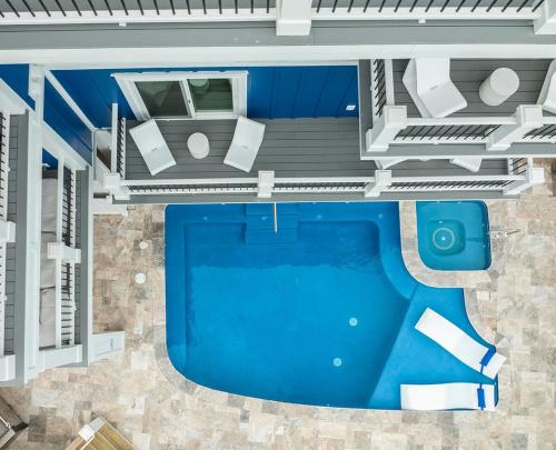 an overhead view of a swimming pool with a house at Huge Beachfront Home with Pool, Hot Tub, Elevator- 4 night minimum stay in Myrtle Beach