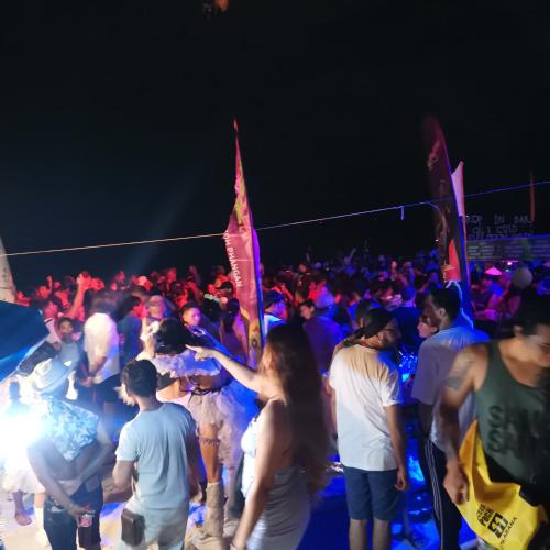 a crowd of people at a party at night at Haadrin village Fullmoon in Haad Rin