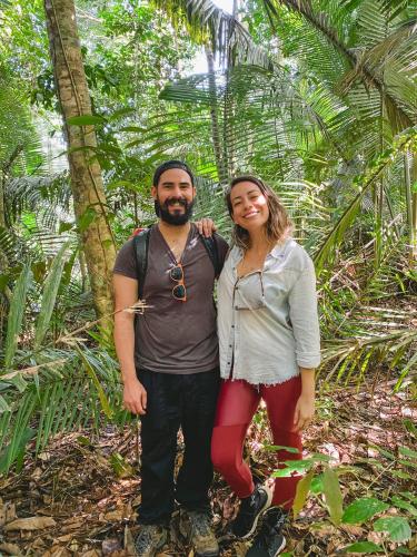 a man and a woman standing in the jungle at Amazon Arowana Lodge in Careiro