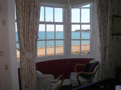 a window with a view of the beach at The Redcliff in Weymouth