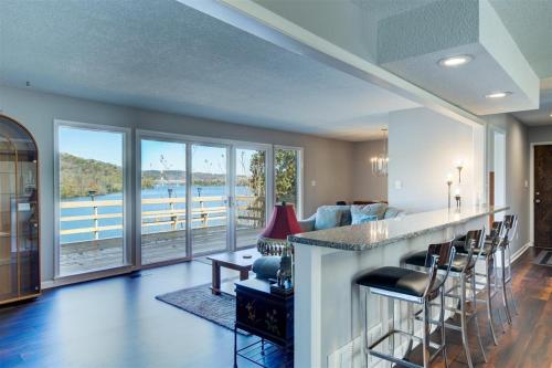a kitchen and living room with a view of the water at Melton Away - Knoxville/Oak Ridge in Knoxville