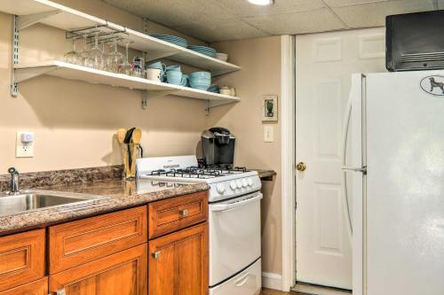 a kitchen with a white refrigerator and a sink at 3 Mi to Bourne Scenic Park Quaint Cape Cod Apt in Bourne