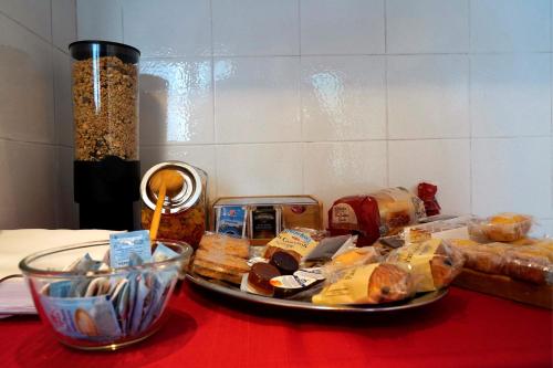 a table with bread and other food items on it at Bed&Biker in Mori
