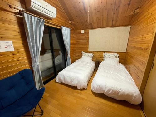 Postel nebo postele na pokoji v ubytování HOCO Kawaguchiko