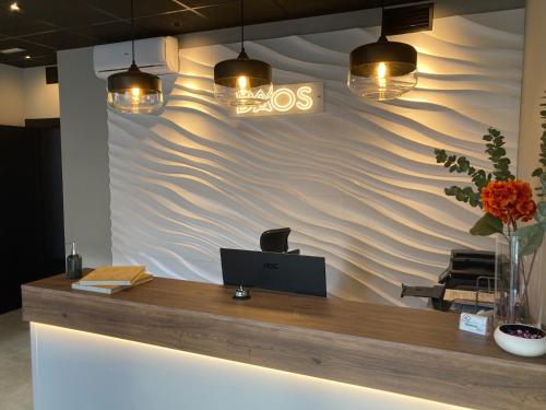 an office with a reception desk with a wave wall at DAOS Suites & Terrace Marbella in Marbella