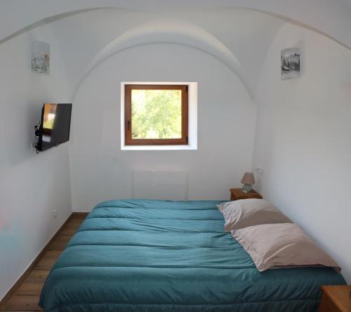 Tempat tidur dalam kamar di Reflets de montagnes