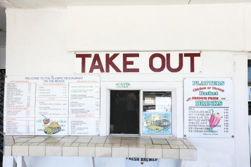 a take out sign on the side of a food truck at Olympic Island Beach Resort in Wildwood Crest