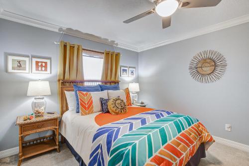 a bedroom with a bed and a ceiling fan at Beautiful Front Row Views - Tiki Bar - Playground in Bolivar Peninsula