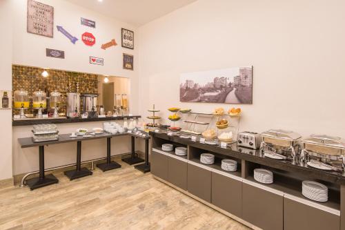 a bakery counter with a lot of food on display at Best Western Plus Urban Larco Hotel in Lima