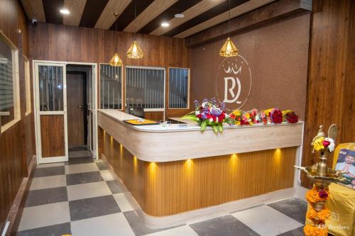 a kitchen with a counter and a sink in a room at DLR GRAND in Tirupati
