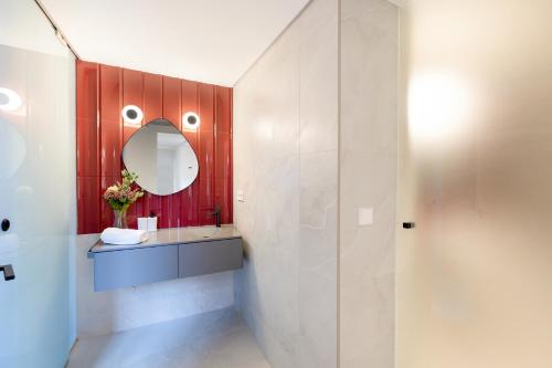 a bathroom with a sink and a mirror at Albaicin Alhambra Views private terrace in Granada