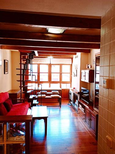 a living room with a couch and a table at La Bruna de Esterri in Esterri d'Àneu
