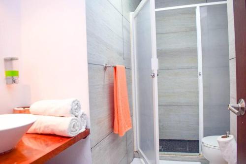 a bathroom with a white sink and a shower at Ocean view apartment, best beach area, 3 bedrooms in Cancún