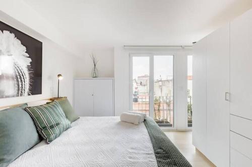 Ένα ή περισσότερα κρεβάτια σε δωμάτιο στο Loft minimalista impecable En pleno Centro Histórico