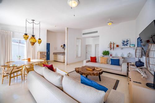 a living room with a couch and a table at Mar del Cabo By Velas Resorts Adults Only in San José del Cabo